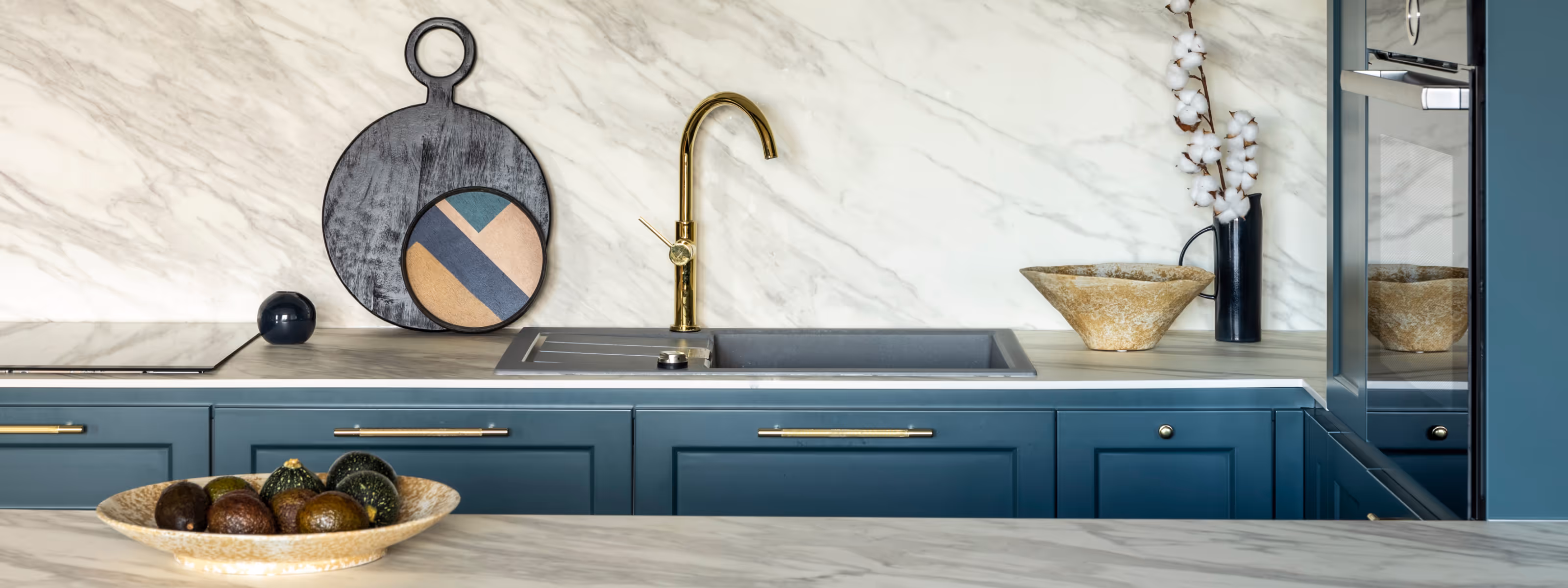Finished basement kitchen plumbing with sink, faucet, and modern cabinetry
