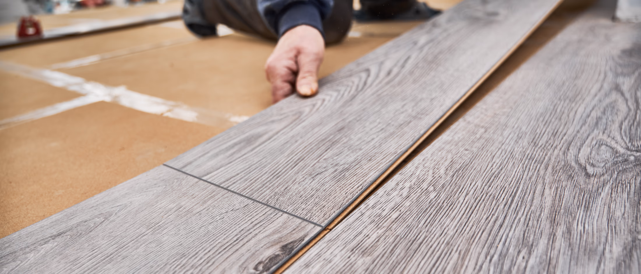 Laminate flooring installation in progress in basement space