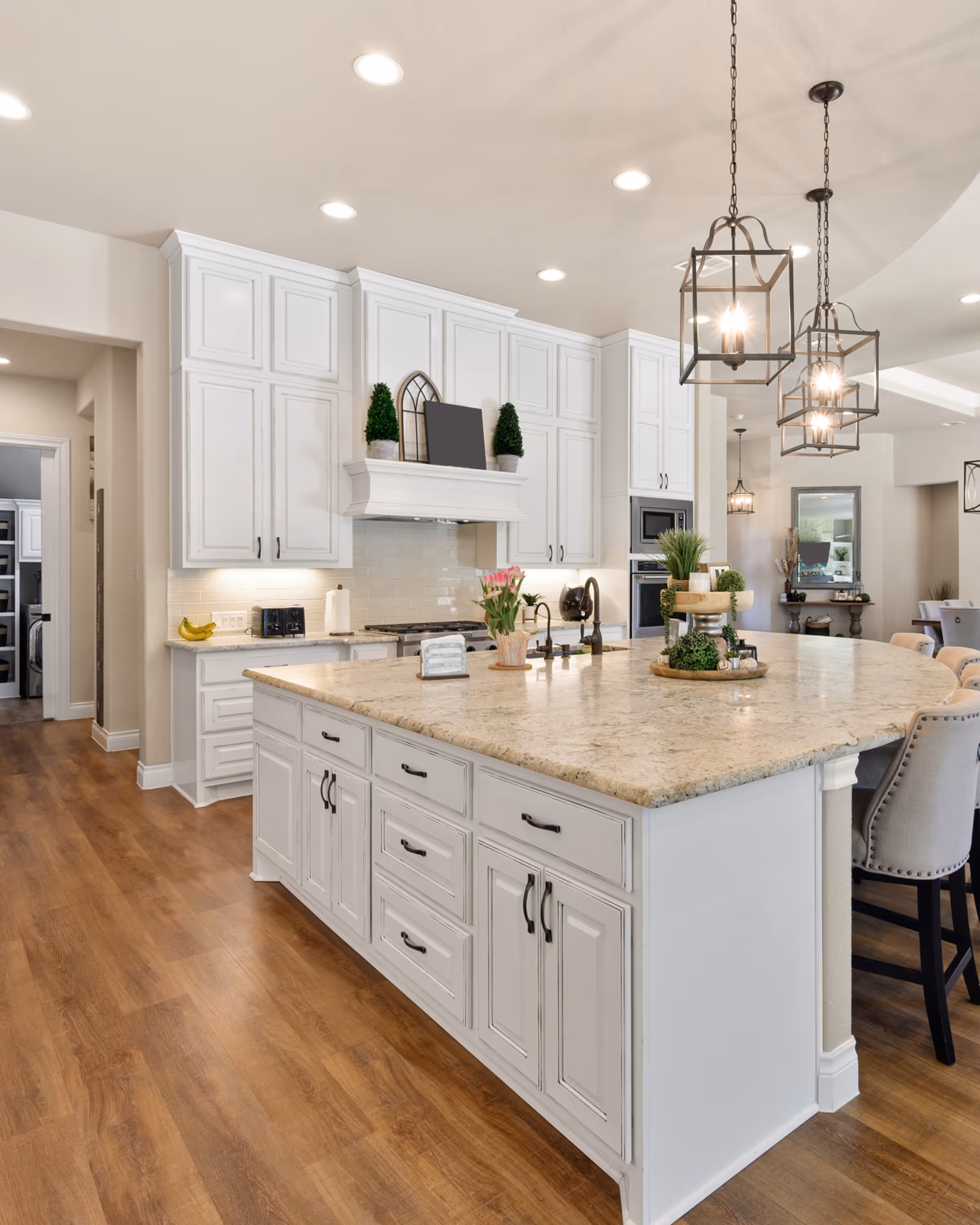Open-concept kitchen renovation in Durham Region with white cabinetry and large island