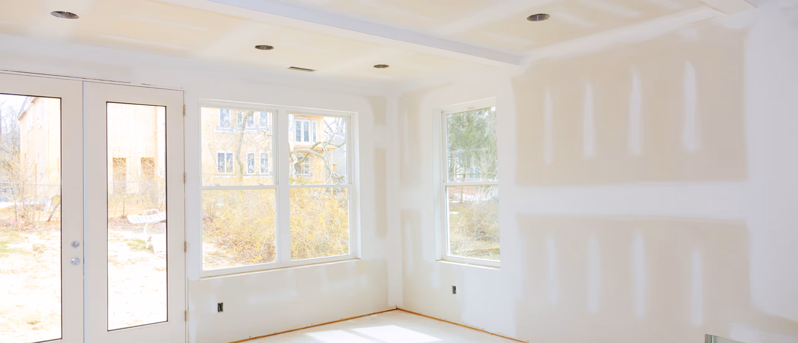 Basement drywall installation and finishing in renovated basement room