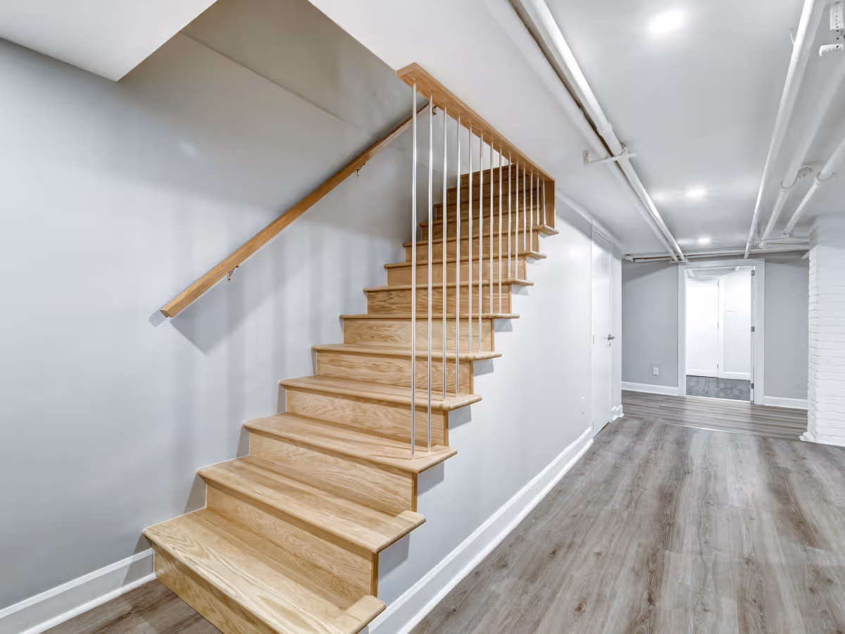 Finished basement vinyl flooring installation in renovated basement