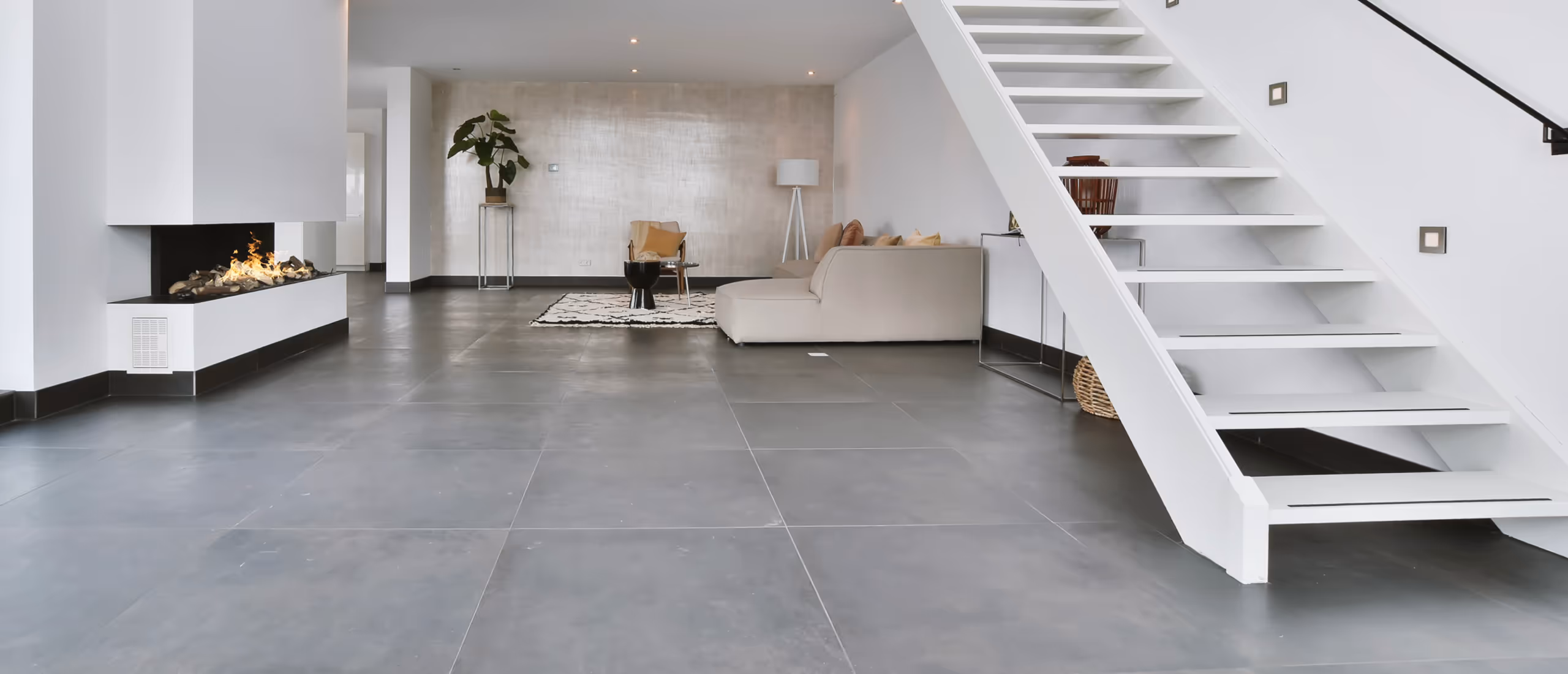 Finished ceramic tile basement flooring in modern renovated basement