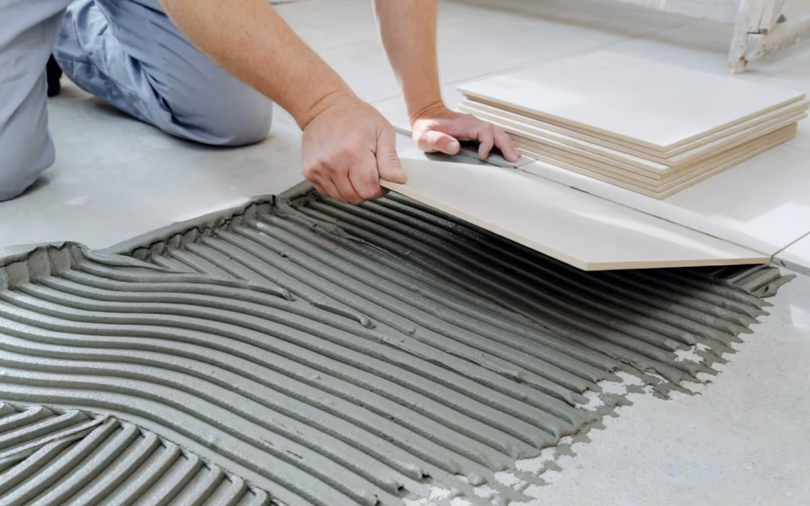 Ceramic tile floor installation with thinset mortar and large-format tiles