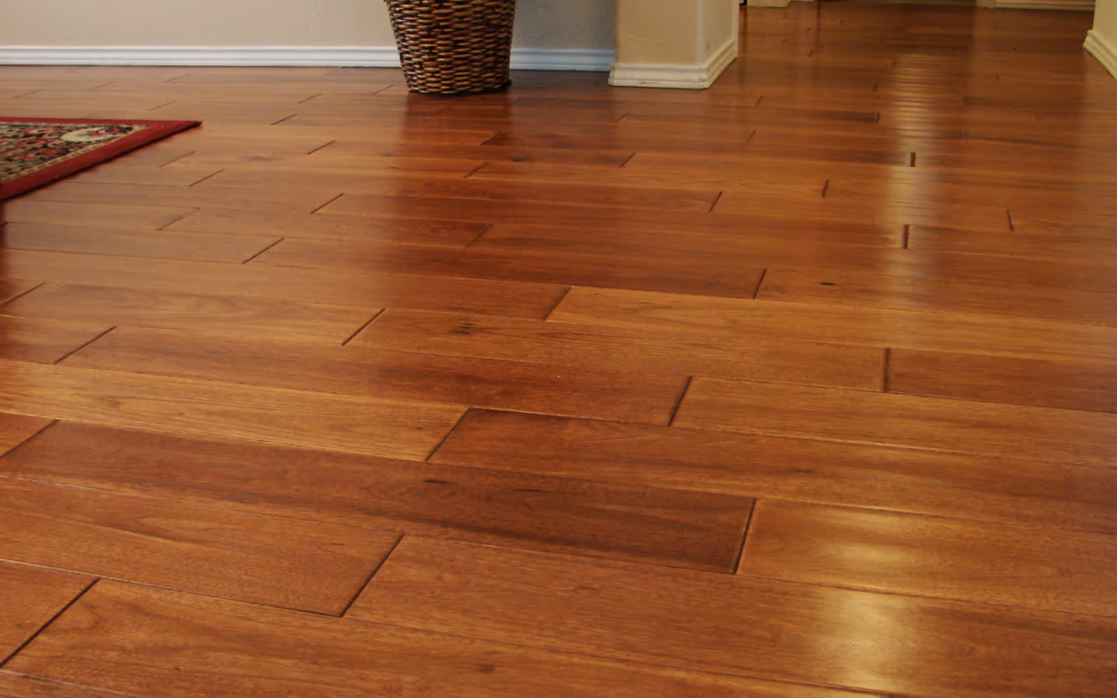 Hardwood flooring with warm brown stain and smooth, even plank alignment