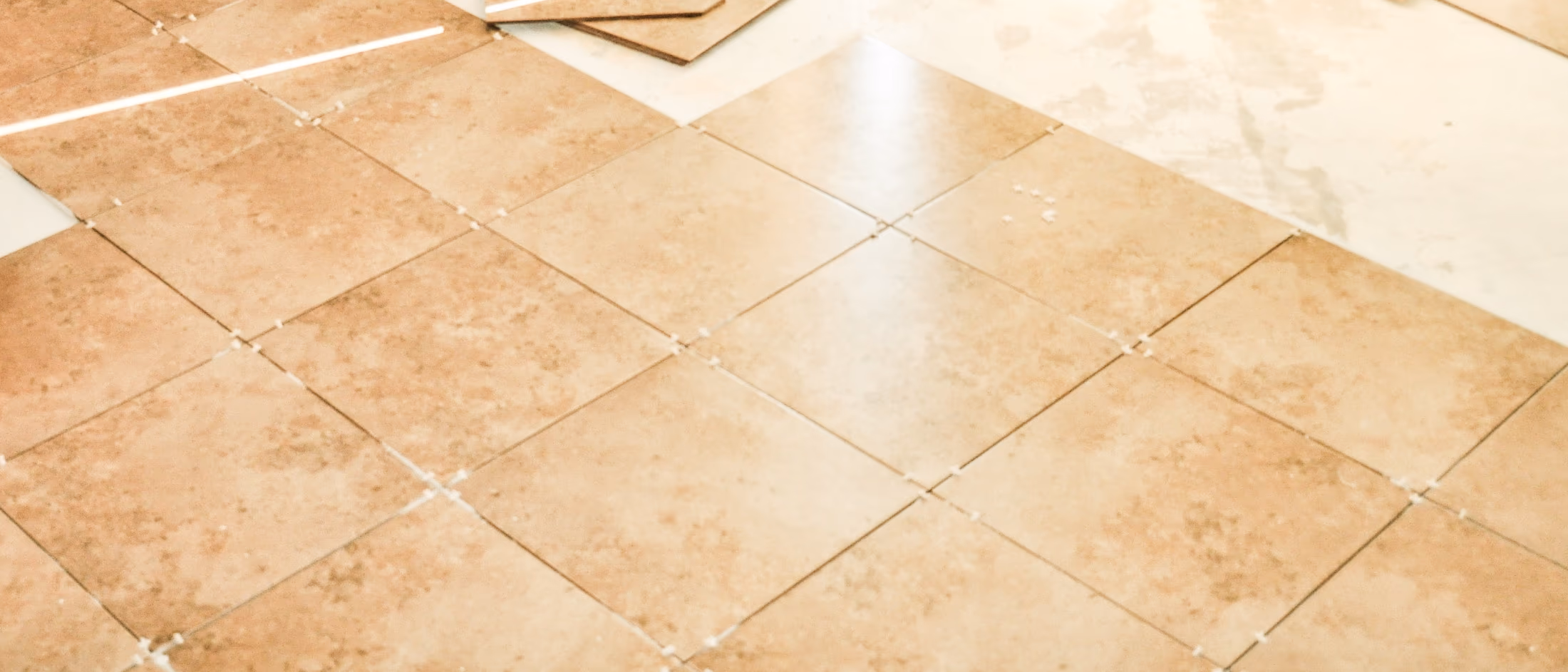Ceramic tile installation for basement flooring during renovation