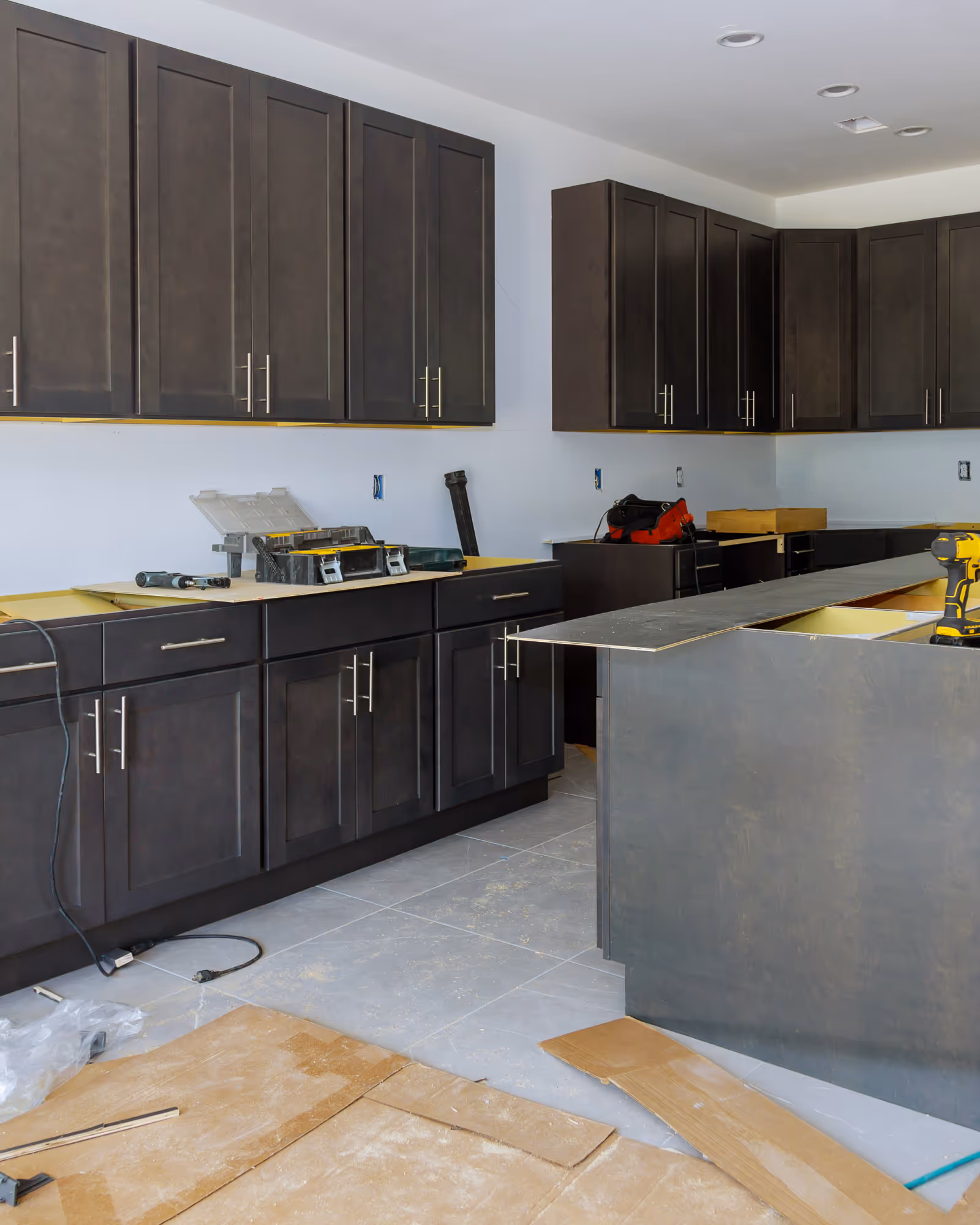 Kitchen renovation in progress with new cabinets installed and island under construction