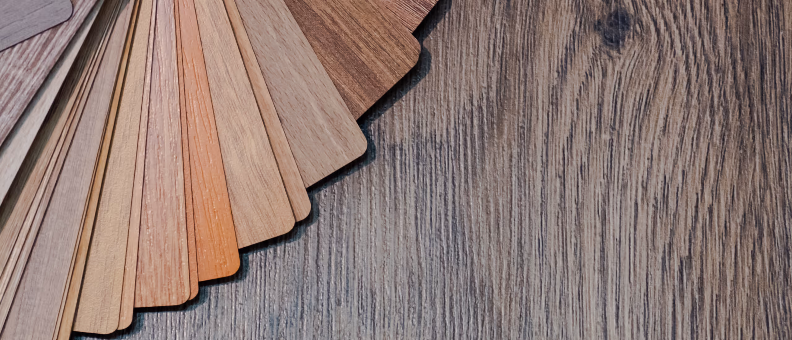 Vinyl flooring color and texture samples for basement renovation