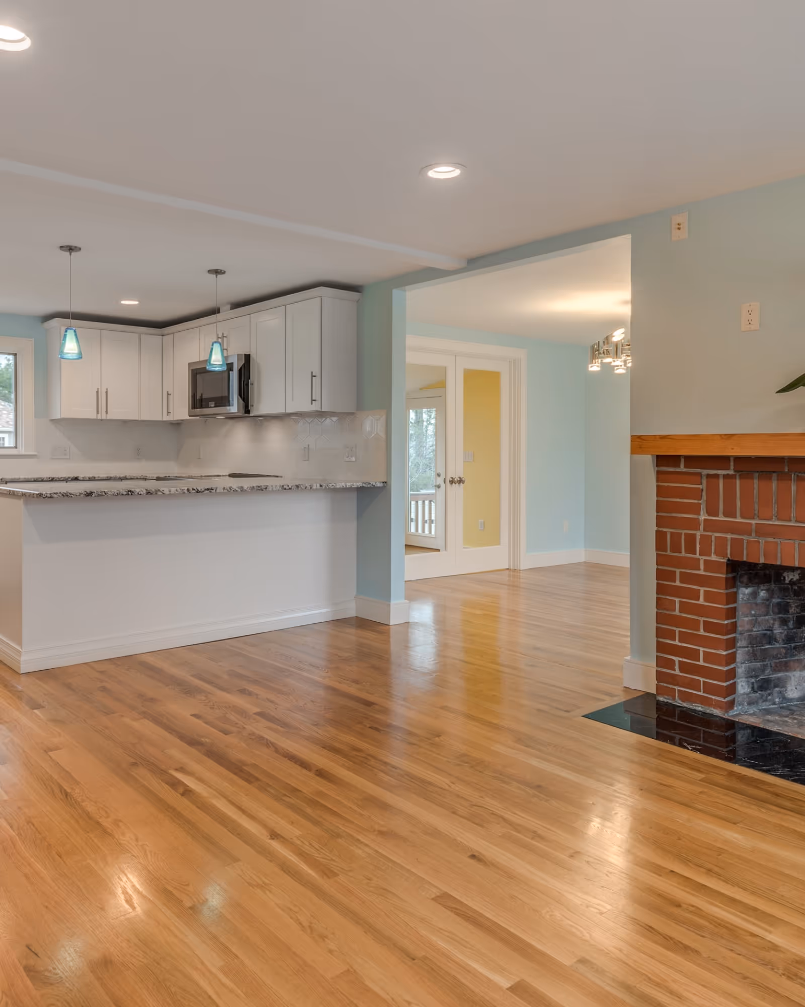 Basement flooring installation in Whitby, Ontario with warm wood finish