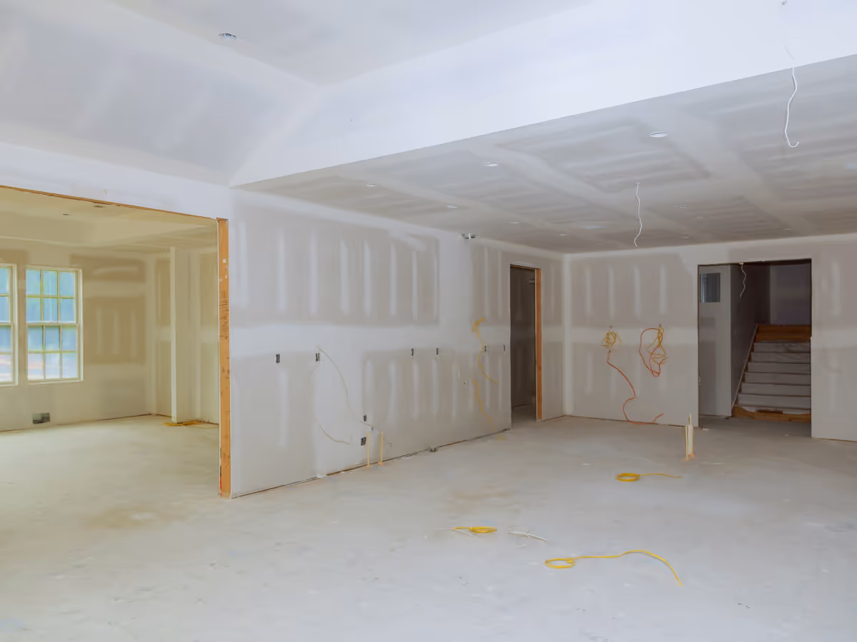 Basement ceiling drywall installation and taping during renovation project