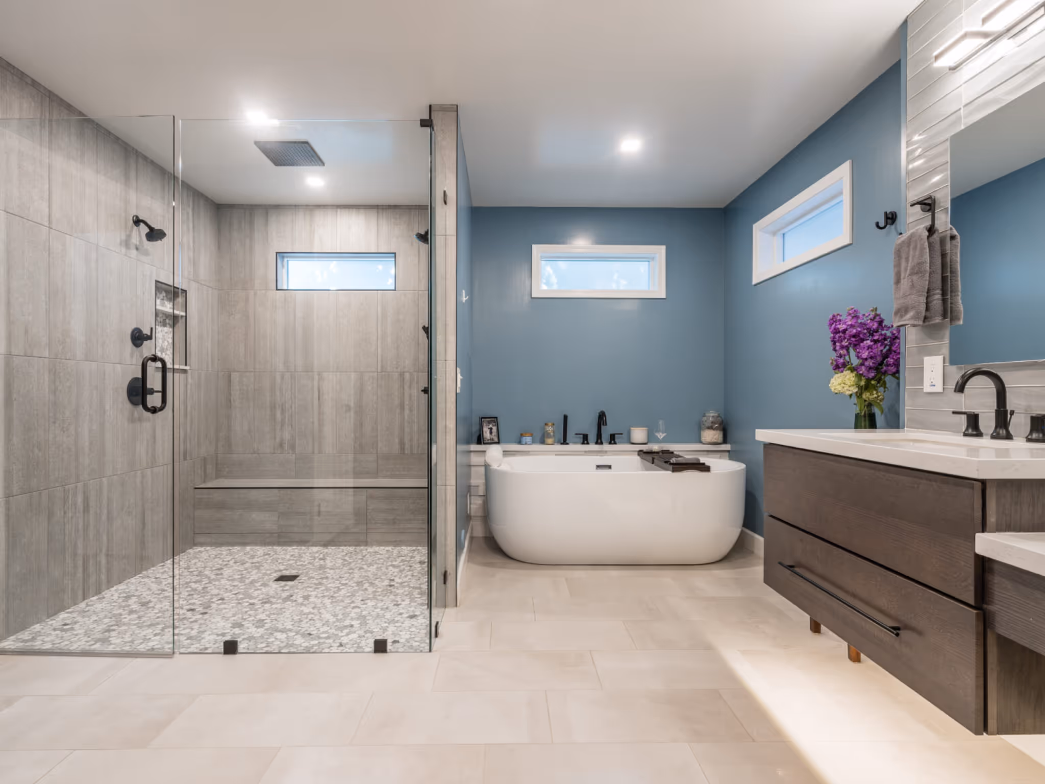 Durham Region bathroom renovation with glass walk-in shower, freestanding tub, and modern vanity