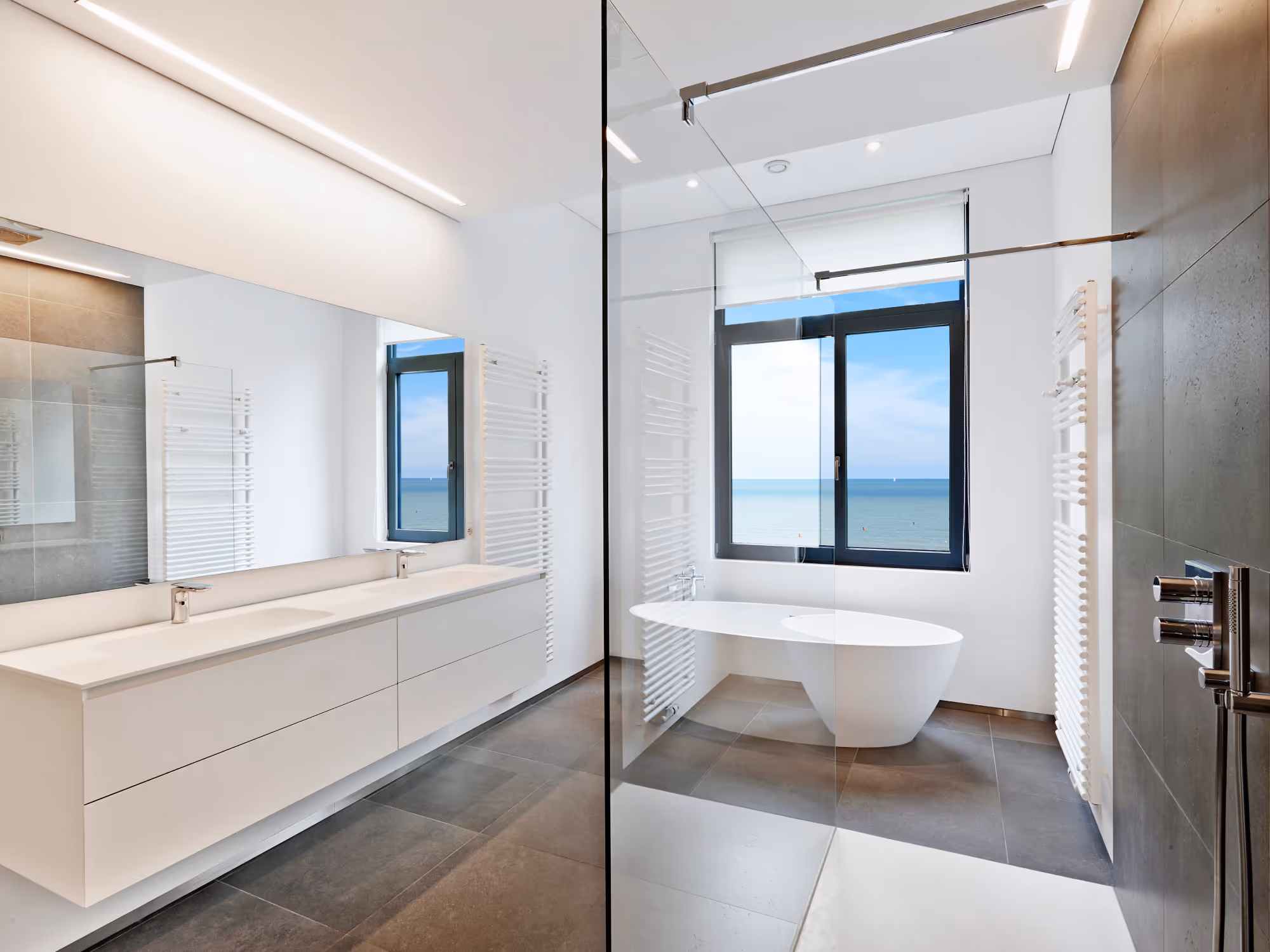 Bathroom renovation with tub surround tile and upgraded fixtures in Durham Region