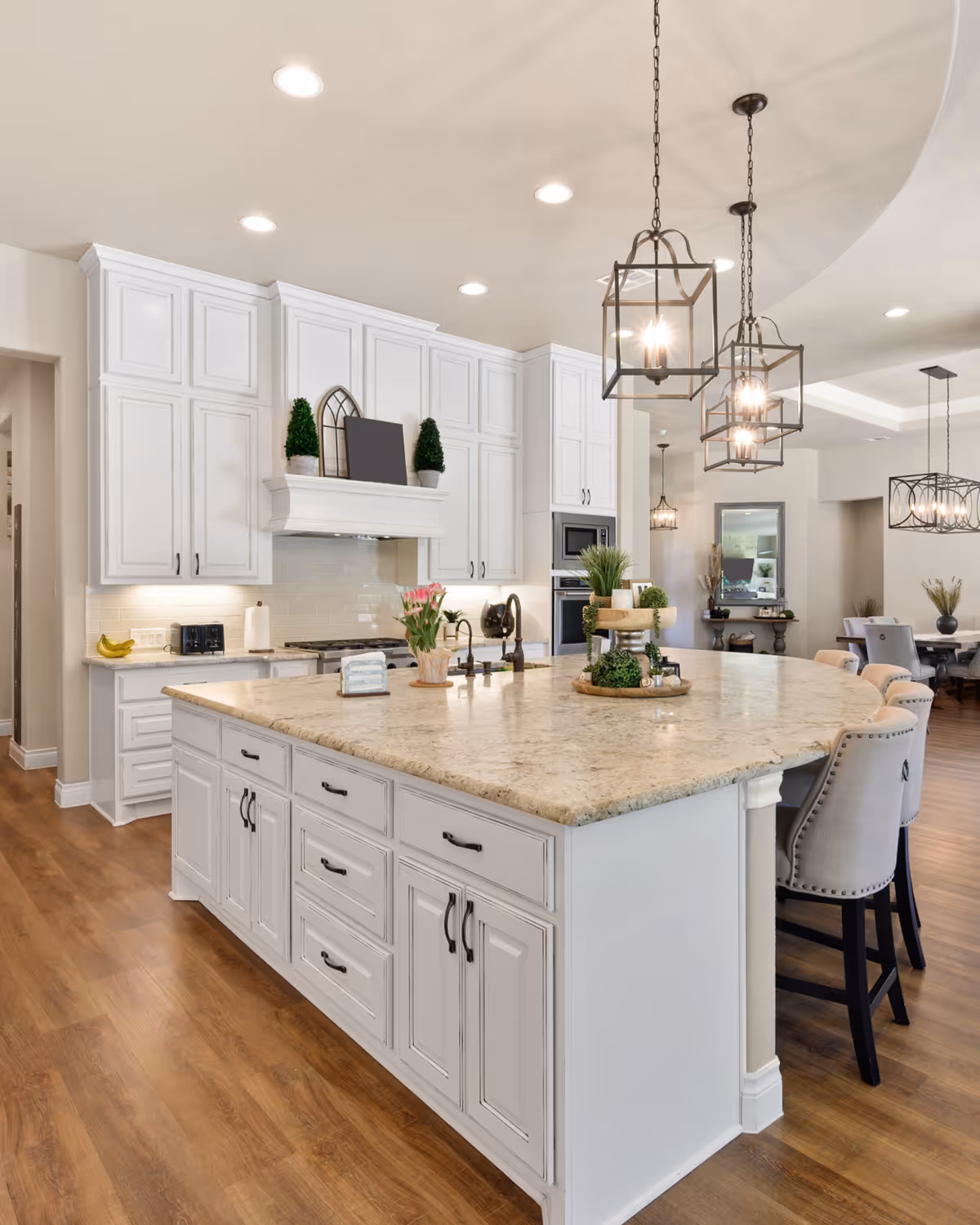 Open-concept kitchen renovation with quartz island and modern pendant lights in Durham Region