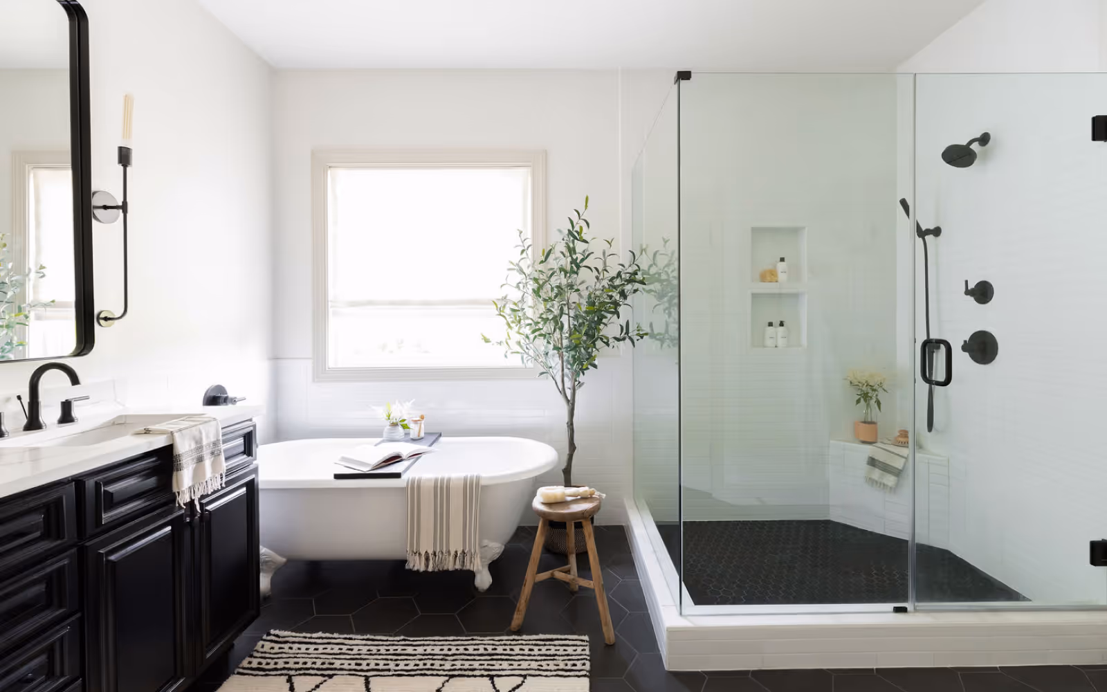 Shower and tub remodel with freestanding bathtub and large glass shower enclosure
